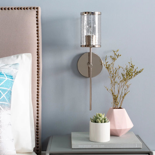 Nasir Wall Sconce - 25315 by Surya in clear, metallic nickel and brushed, black sand. Made from glass, metal in a modern style.