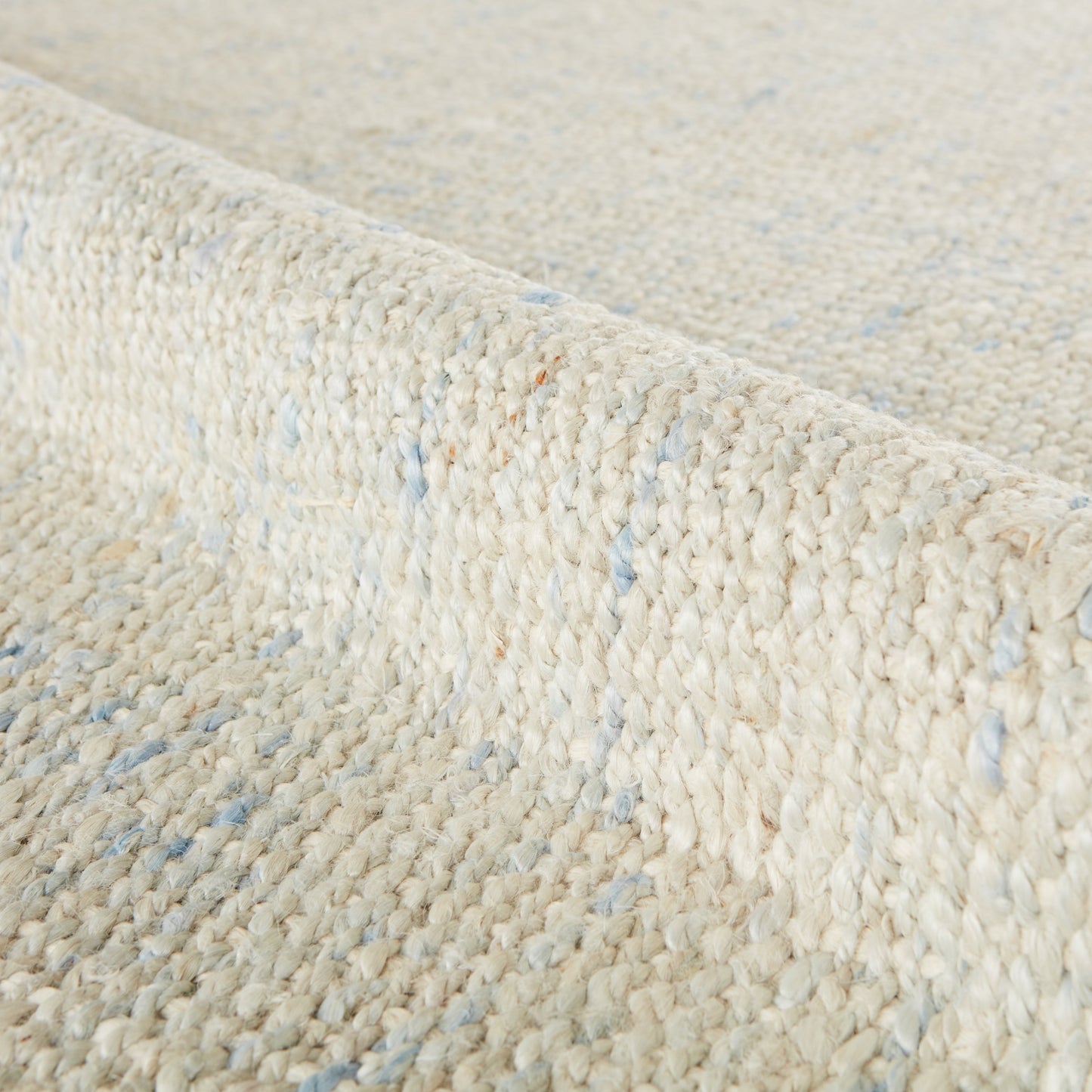005 105491-20279,105491-20281,105491-45400,105491-45401,SI-2386329 | Closeup | Naturals Tobago NAT34 Rug by Jaipur Living in ivory, blue. Made from 100% jute in a unique style.