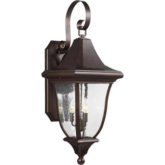 Oakmont Outdoor Wall Lantern by Generation Lighting in patina bronze. Made from cast aluminum in a traditional style.