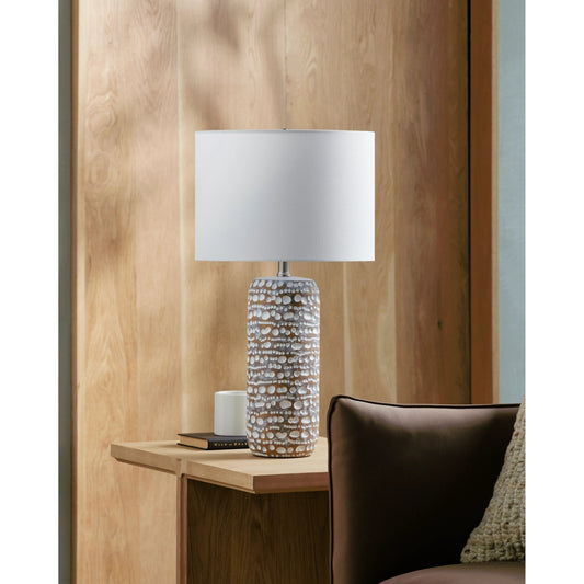 Oswego Table Lamp by Surya in translucent, brown, white, metallic nickel, metallic silver and painted. Made from body: resin, shade (outside): linen, shade (inside): linen, finial: metal in a modern style.