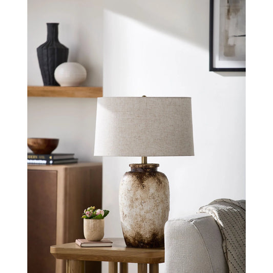 Ostuni Accent Table Lamp by Surya in wheat, cream, translucent, metallic gold, white, metallic brass. Made from cement, linen, plastic, iron in a rustic style.