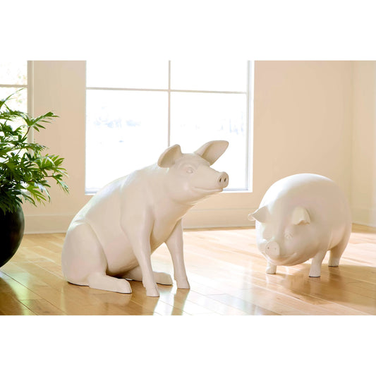 Happy Pig Sculpture by Phillips Collection in off white. Made from resin in a modern style.