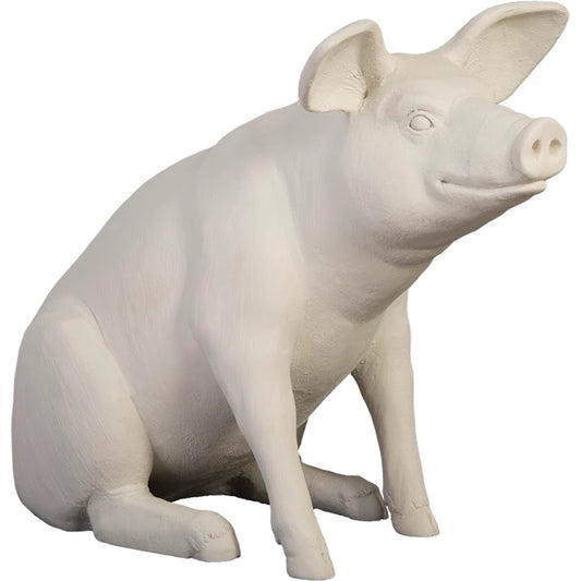 Happy Pig Sculpture by Phillips Collection in off white. Made from resin in a modern style.