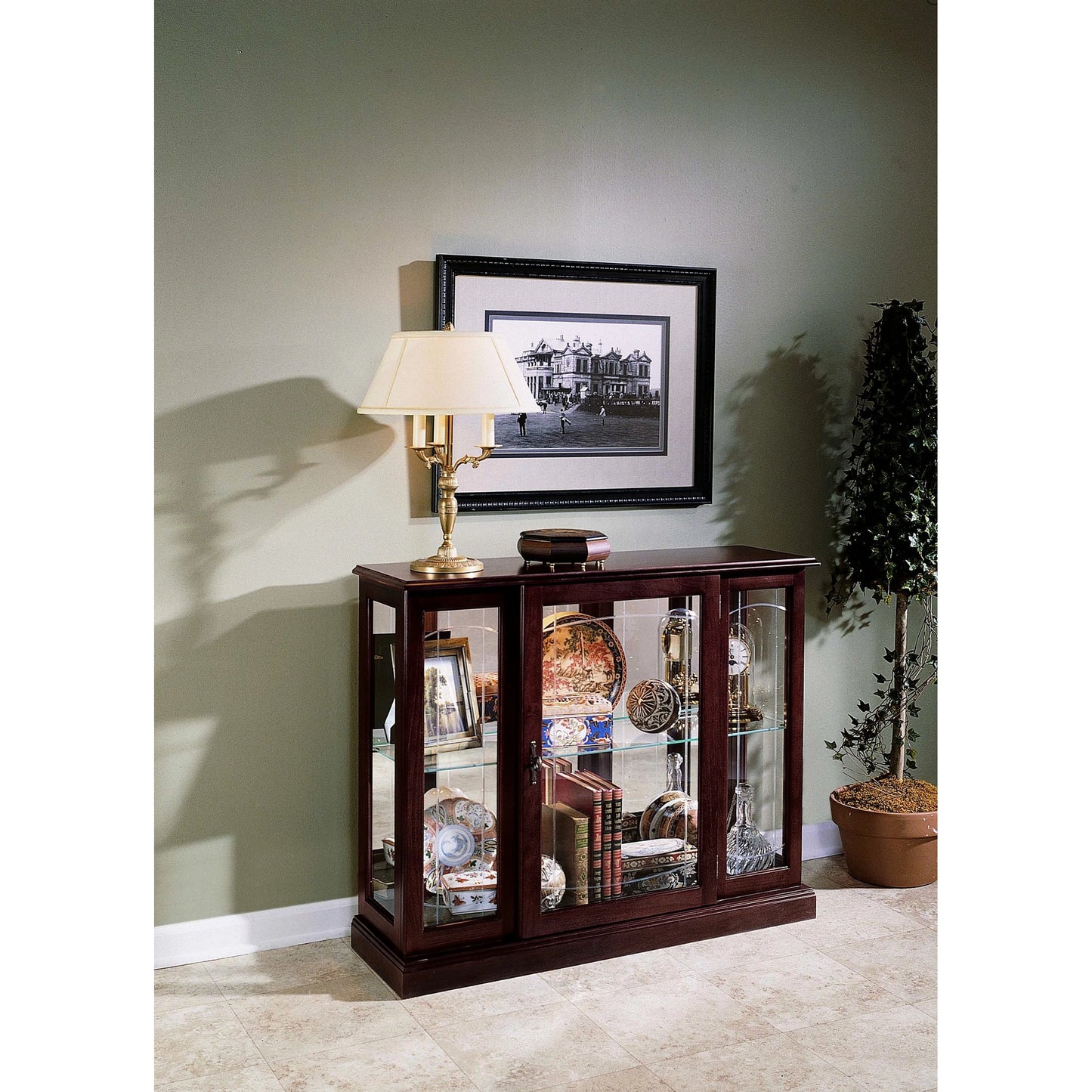 006 SI-2155473 | Lifestyle | Curio Console by Pulaski Furniture in cherry brown. Made from select hardwoods in a traditional style.