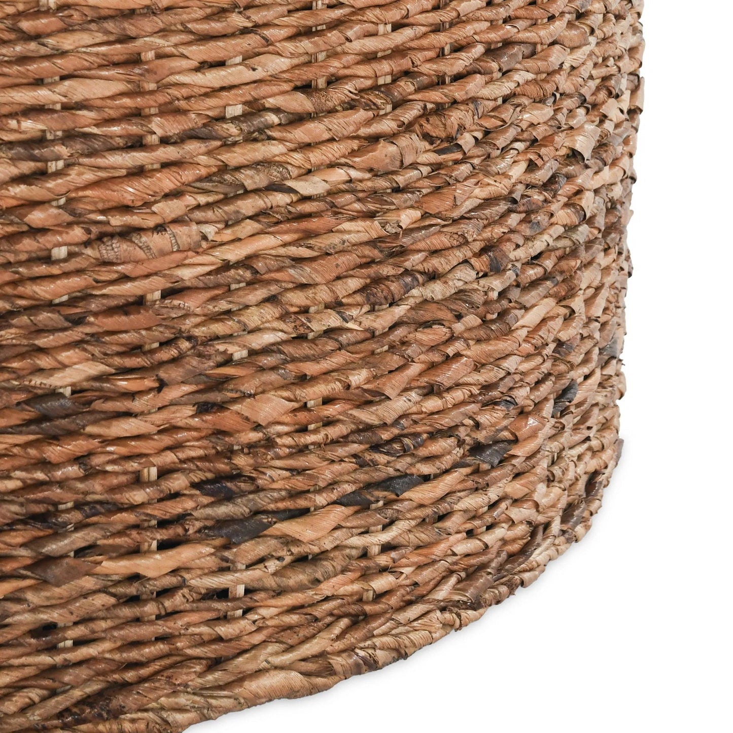 004 SR-897711 | Closeup | Ira Round Rattan Coffee Table by Kosas Home. Made from rattan abaca in a coastal style.