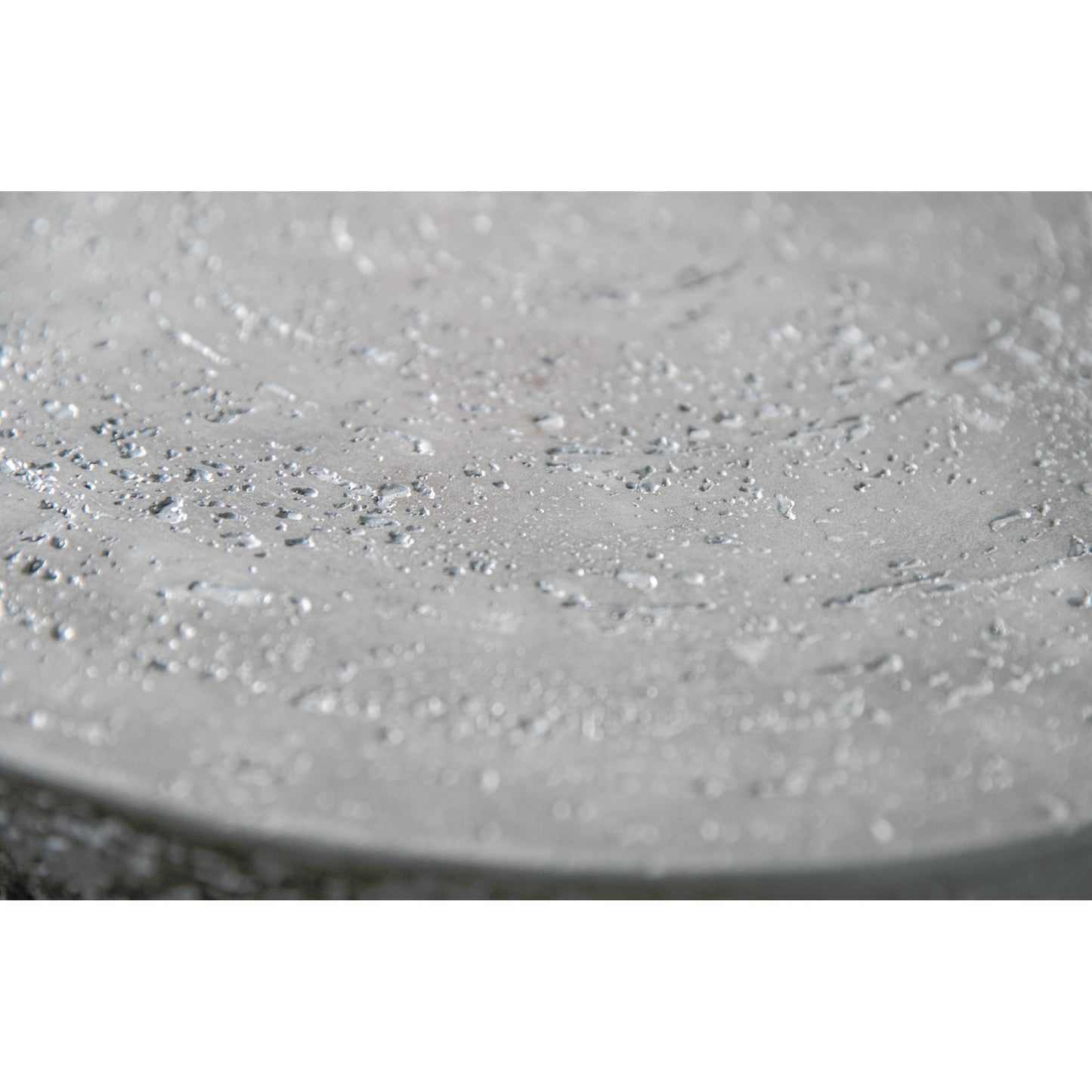 002 SI-2167253 | Closeup | Gravelstone Outdoor Round Fire Table by Sunset West in gravelstone. Made from gfr concrete in a modern style.
