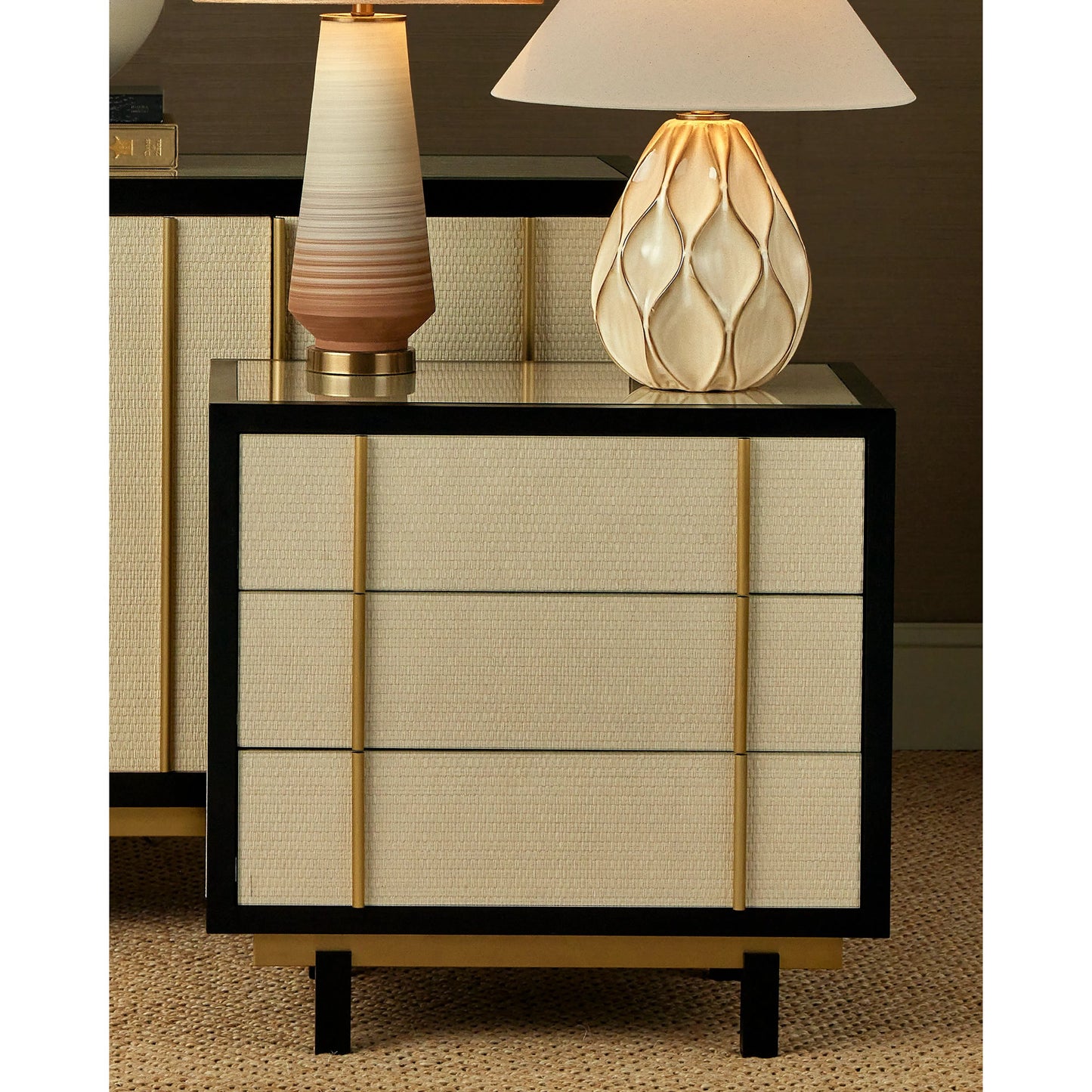 009 SI-2191701 | Lifestyle | Deanna Raffia Nightstand by Currey and Company in ivory, black, brushed brass, natural, dusty blue, clear. Made from raffia, okume veneer, stainless steel, sycamore veneer, tempered glass in a modern style.