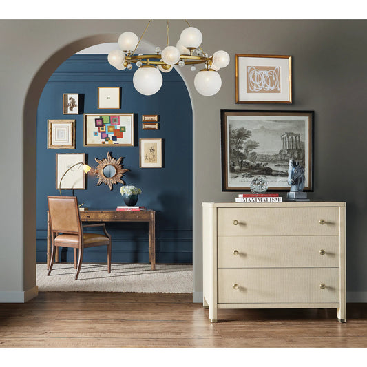 Archives Raffia Three-Drawer Chest by Hooker Furniture in flax. Made from oak veneers, raffia, cedar, metal caps in a transitional style.