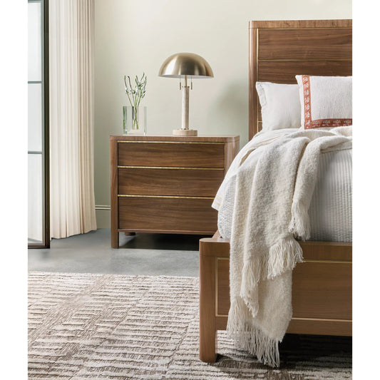 Eleana Three Drawer Nightstand by Hooker Furniture in light caramel, quartered walnut veneers, sunlit bronze metal. Made from walnut veneers in a modern style.