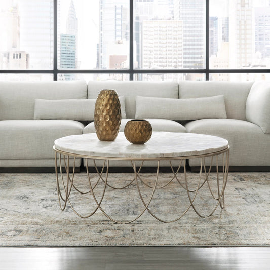 Round Stone Top Cocktail Table with Decorative Metal Base by Pulaski Furniture in gold. Made from stone in a modern style.