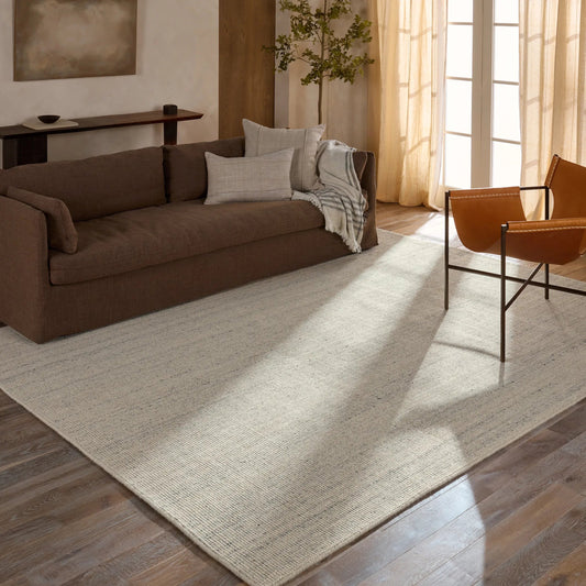 Rene RNE03 Rug by Jaipur Living in ivory. Made from 100% wool in a unique style.