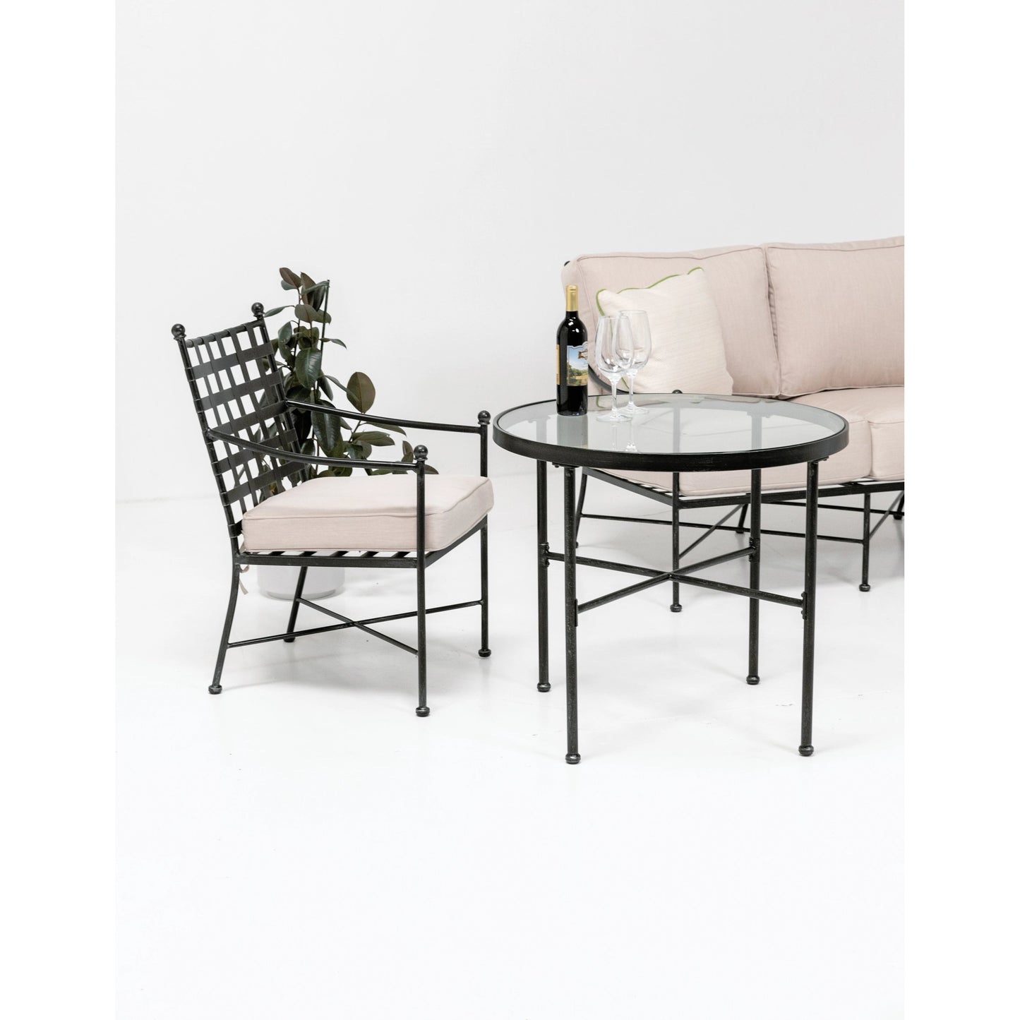 004 SI-2166923 | Lifestyle | Provence Outdoor Bistro Table by Sunset West in pewter. Made from wrought iron in a modern style.