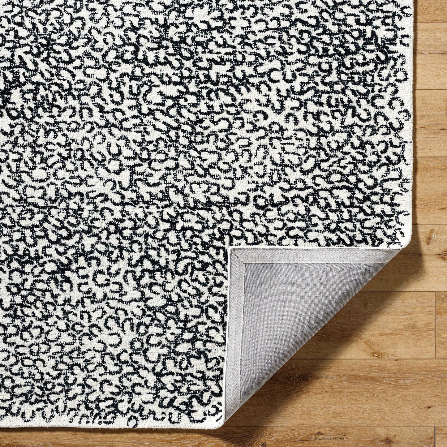 005 SI-2167637,SI-2167638,SI-2167639,SI-2167640,SI-2167641,SI-2167642 | Closeup | Rize Rug - 488617 by Livabliss in charcoal, ash gray, snow white. Made from wool in a unique style.