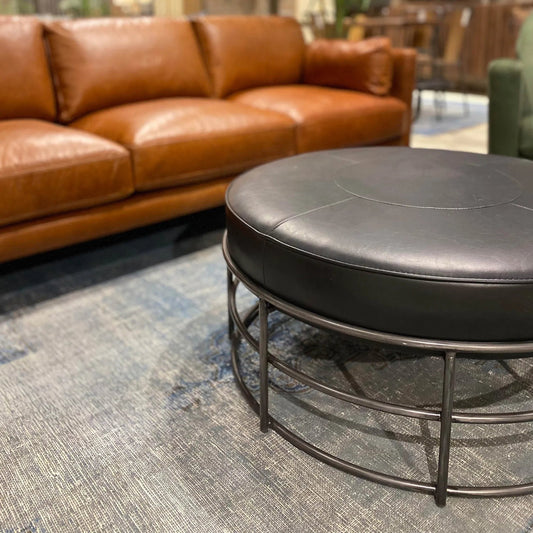 Ziggy Ottoman by LH Imports in black and gunmetal. Made from pu leather, iron, polyester fiber, pu foam in a modern style.