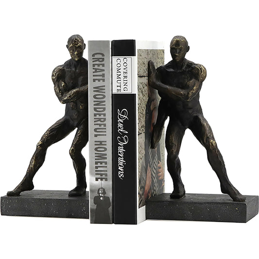Pushing Men Bookends by Zentique in rustic dark bronze. Made from resin in a modern style.