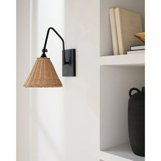 Semilla Wall Sconce by Livabliss in fixture: black; shade: brown; cord: white and metallic, painted. Made from iron, rattan in a rustic style.
