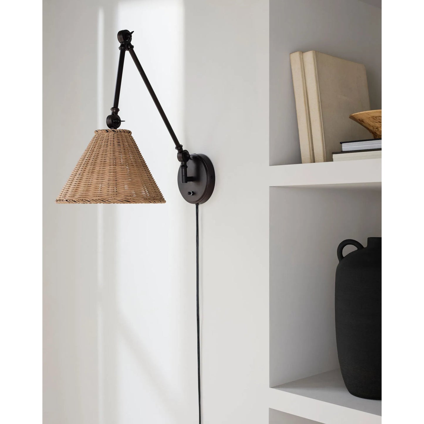 003 SI-2245759 | Lifestyle | Semilla Wall Sconce Swing Arm by Livabliss in fixture: black; shade: brown; cord: white and paintedpaintedmetallic. Made from iron, rattan in a rustic style.