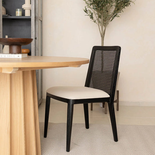 Cane Dining Chair by LH Imports in black. Made from ash, pu foam, polyester fiber, linen, cotton, rattan in a modern style.