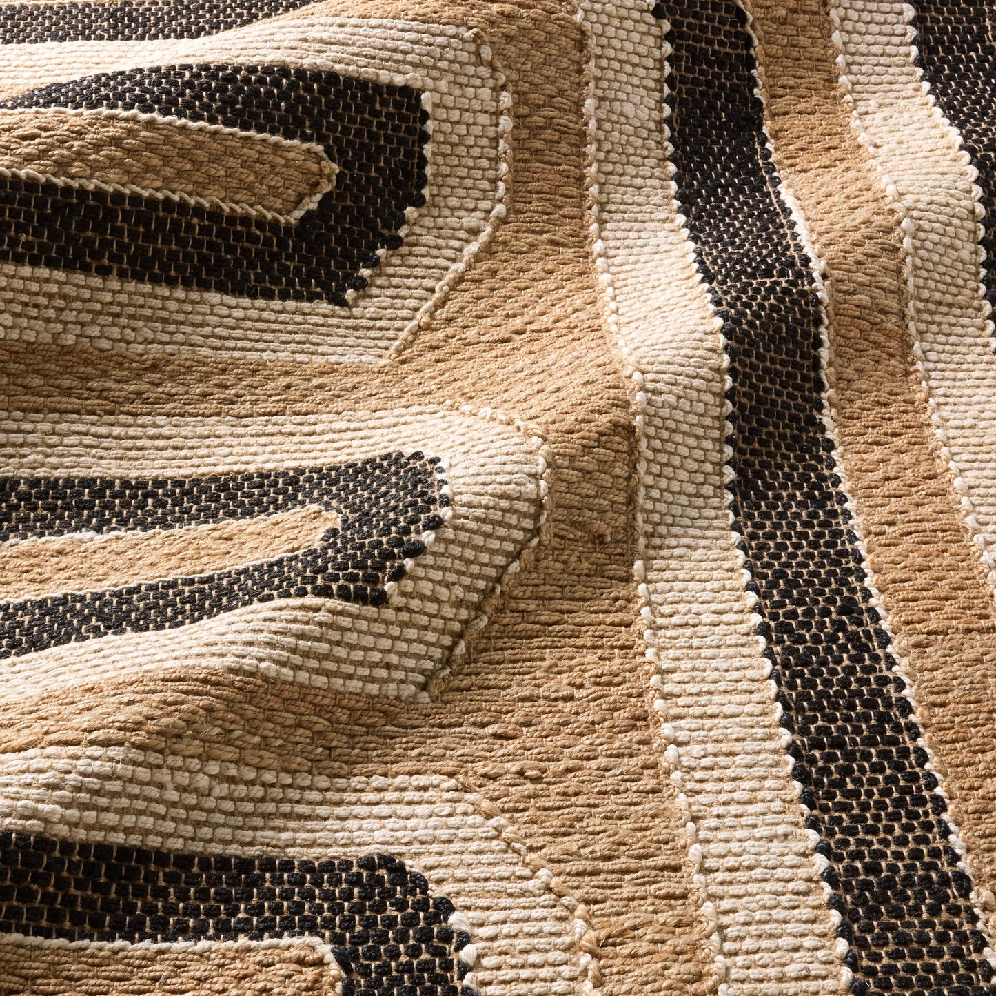 006 SI-2531420,SI-2531421,SI-2531422,SI-2531423,SI-2531424,SI-2531425 | Closeup | Song Of The Sahara SOS02 Rug by Jaipur Living in tan, beige, black. Made from 100% jute in a unique style.