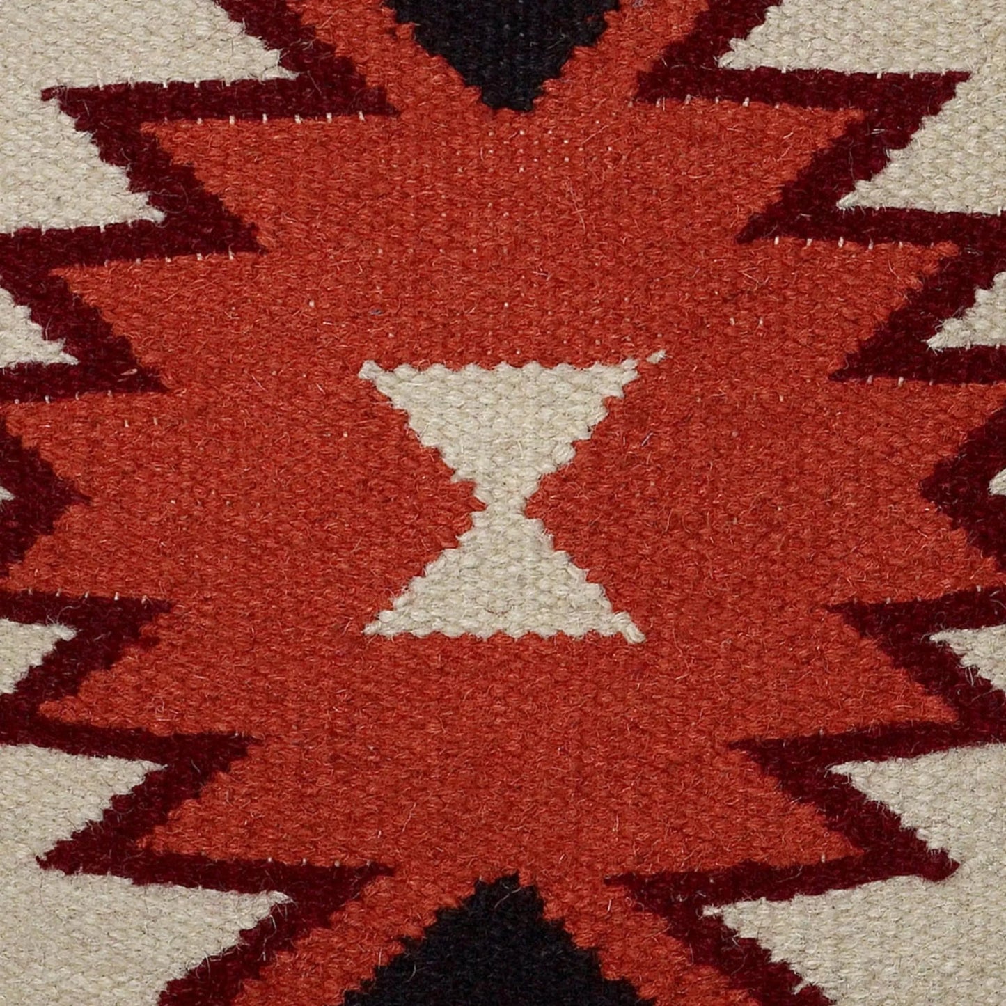 002 SI-2438879 | Closeup | Bertie Pillow by HedgeApple Essentials in orange, black, ivory. Made from wool in a rustic style.
