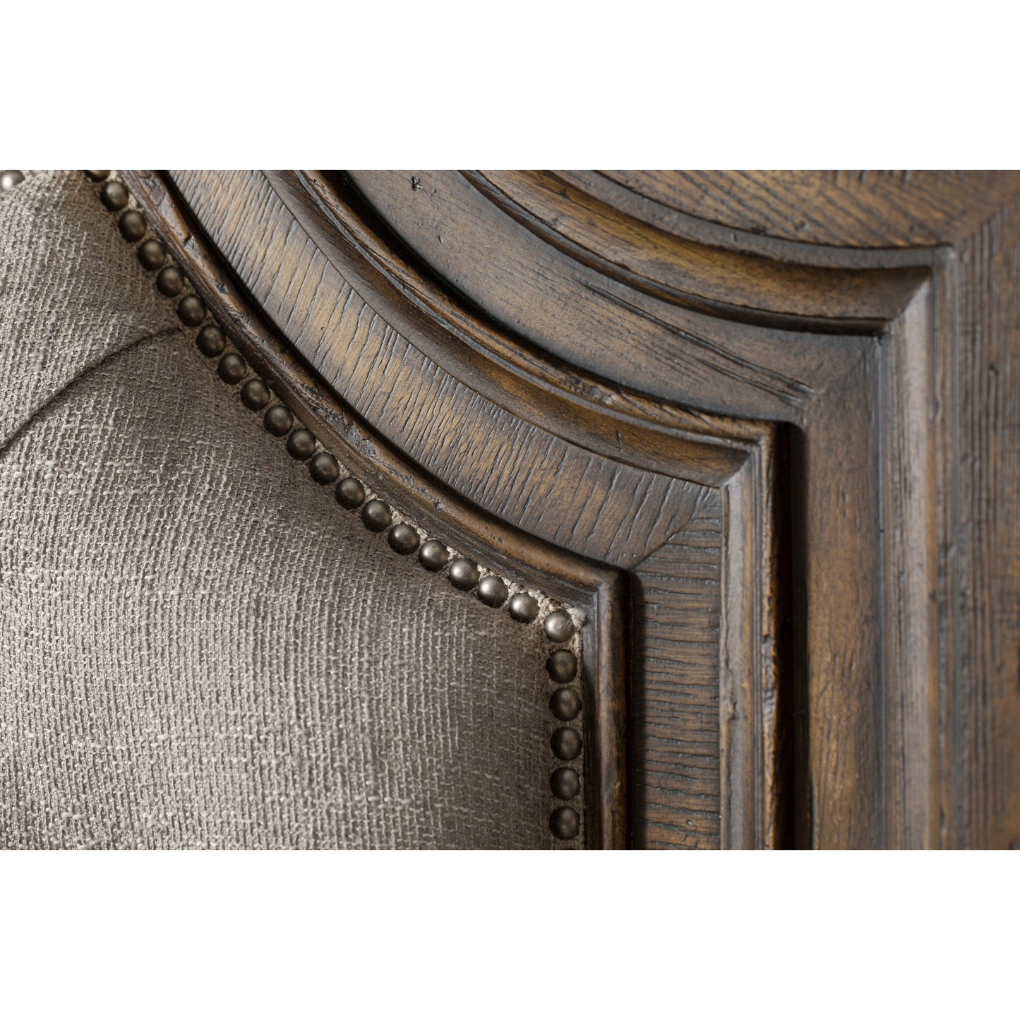 005 SI-1748914,SI-1748916 | Closeup | Fair Oaks Upholstered Bed by Hooker Furniture in beige and saddle brown, blackwood desert. Made from white oak veneers, fabric, resin in a traditional style.