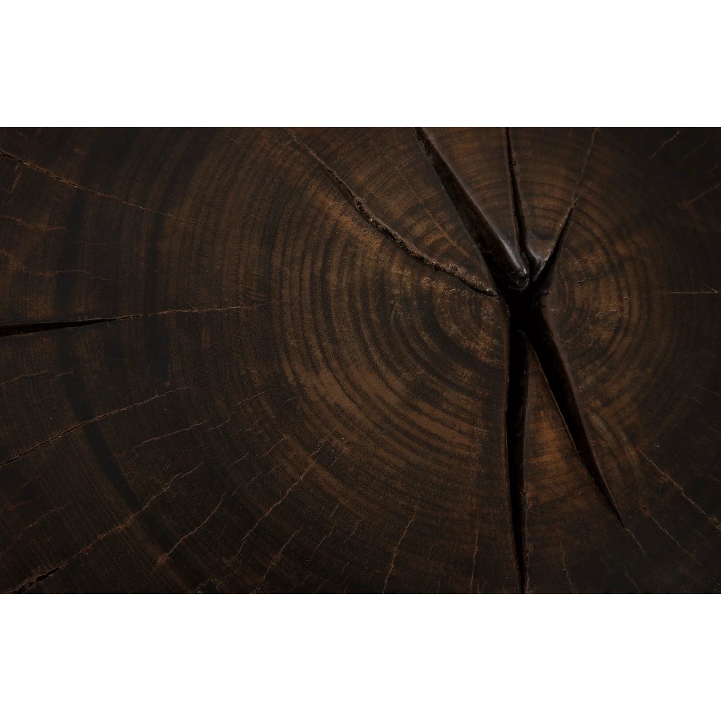 003 SI-1944752 | Closeup | Black Wood Stool I by Phillips Collection in brown. Made from wood in a rustic style.