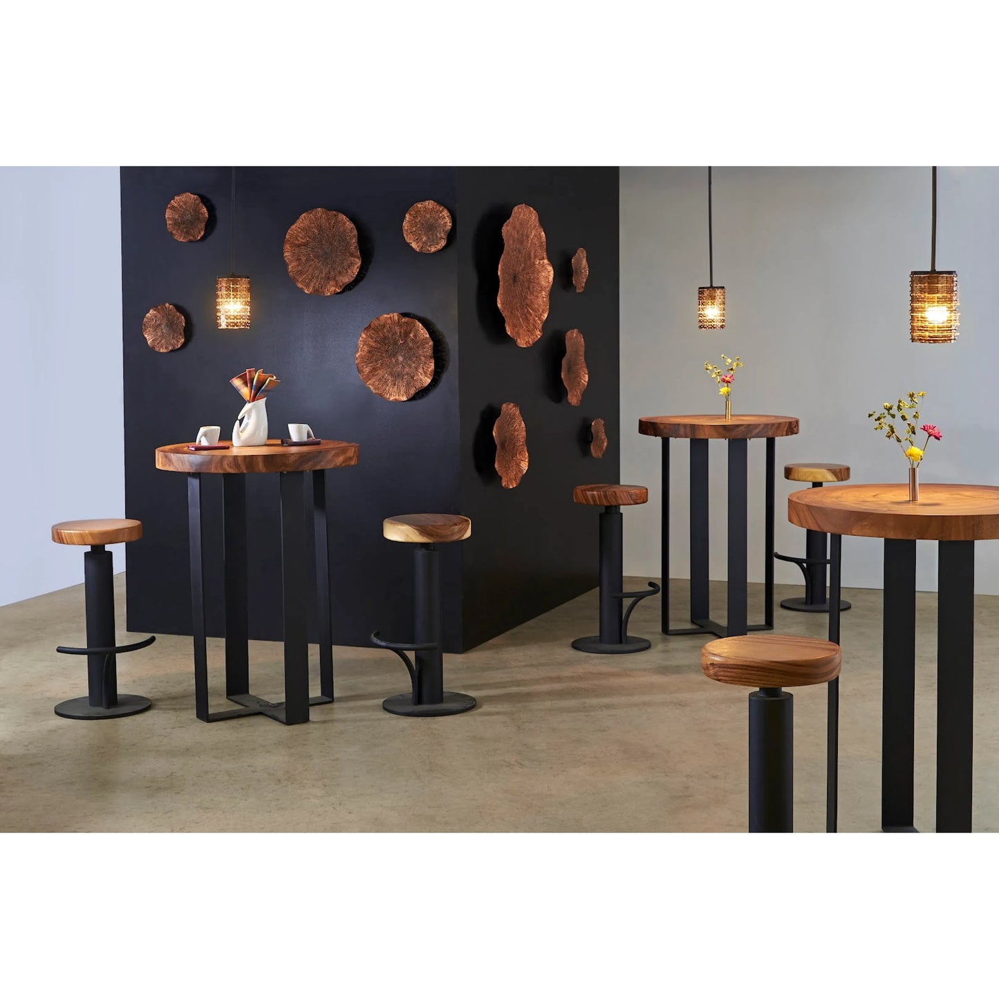 007 SI-1786298 | Lifestyle | Chuleta Bar Table on Black Metal Base by Phillips Collection in gray stone. Made from unique in a modern style.