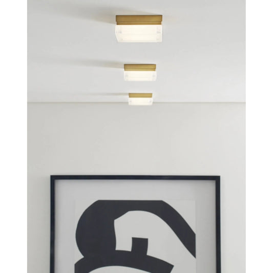 Boxie Small Flush Mount LED by Visual Comfort & Co. in natural brass. Made from glass in a modern style.
