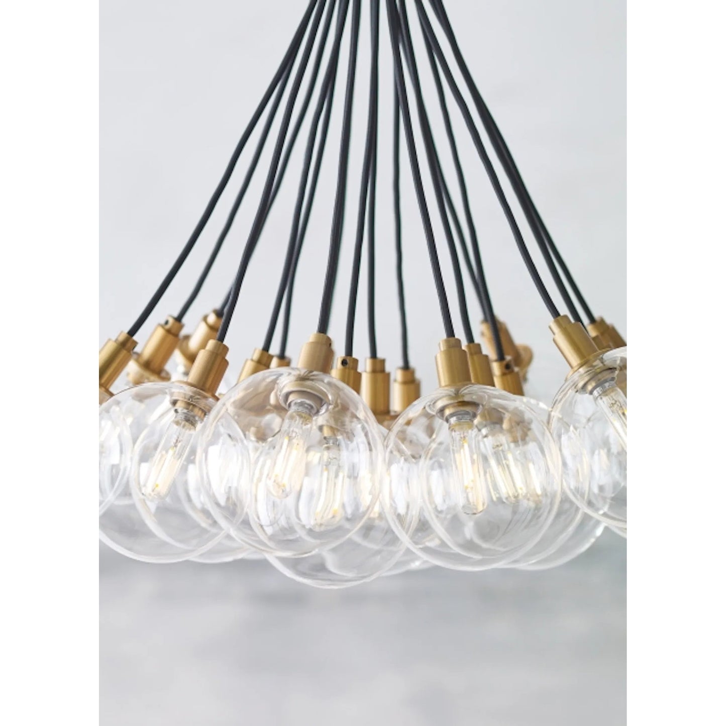 004 SR-807711,SR-807712 | Closeup | Gambit Multi-Port Chandelier by Tech Lighting in aged brass. Made from glass in a modern style.