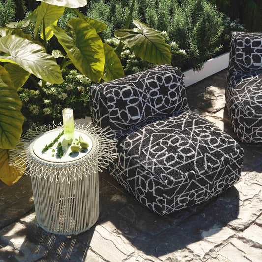 Chiara Outdoor Accent Pouf by TOV Furniture in black, white. Made from polyester in a eclectic & global style.