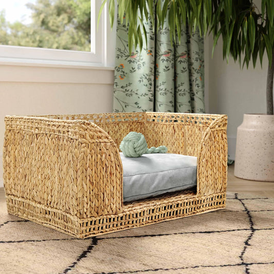 Milou Rattan Pet Bed by TOV Furniture in natural. Made from natural cane in a rustic style.