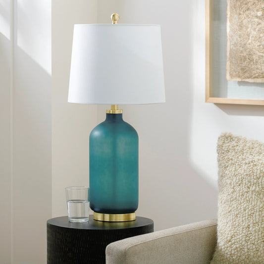 Treyvon Accent Table Lamp by Surya in gold, translucent, metallic nickel, white, green and brushed. Made from body: glass, base: metal, shade (outside): linen, shade (inside): polyester, finial: metal in a modern style.