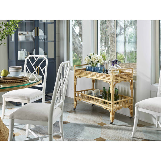 5 O'Clock Bar Cart by Coastal Living by Universal Furniture in antique brass and natural rattan. Made from unique in a coastal style.