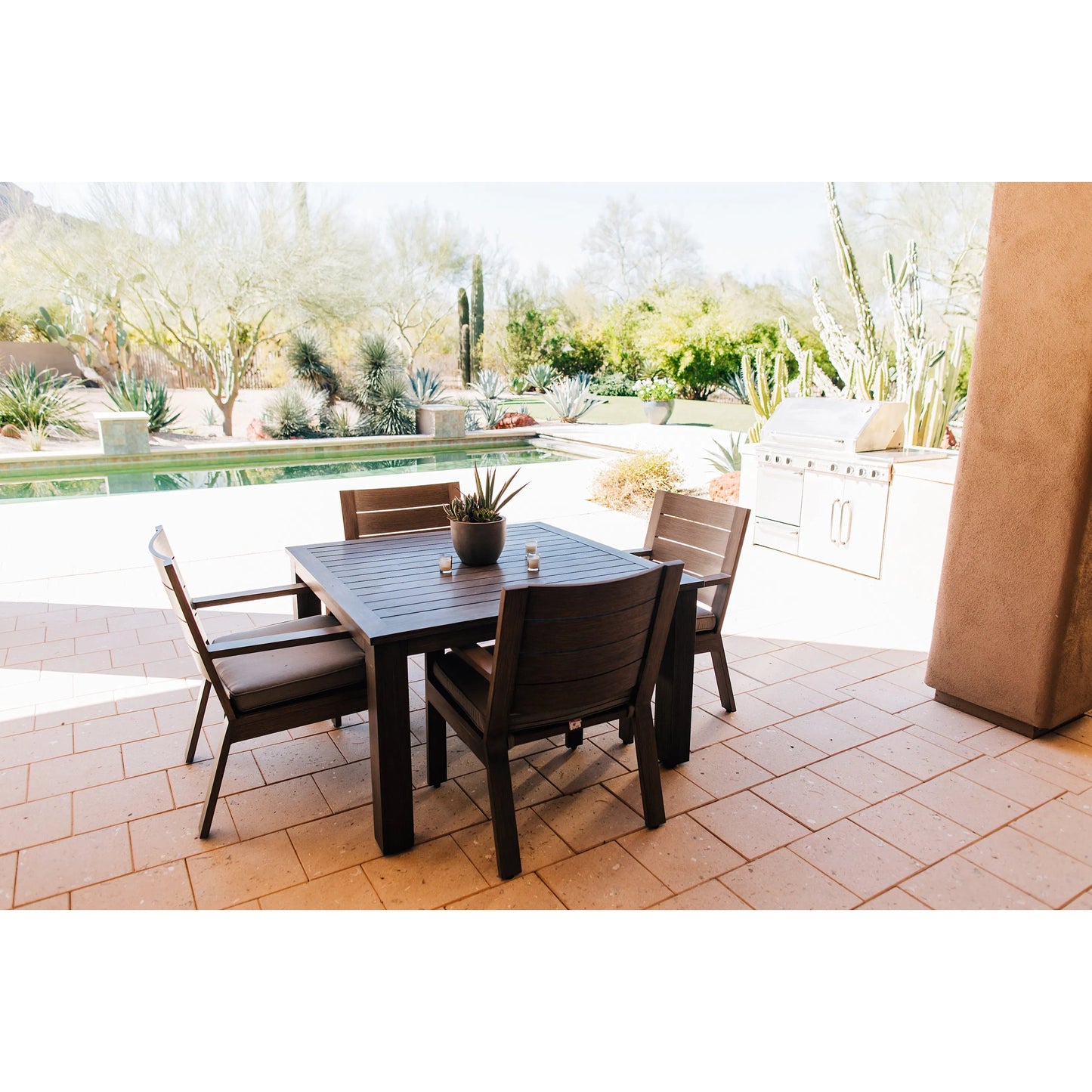 009 SI-2166945 | Lifestyle | Laguna Outdoor Dining Chair by Sunset West in driftwood. Made from aluminum in a modern style.
