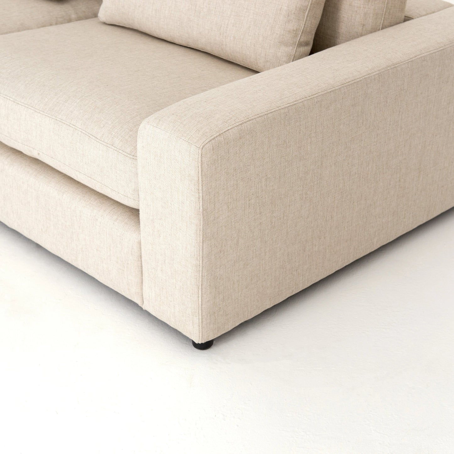 011 SI-1714490 | Closeup | Bloor 4 Piece Sectional with Ottoman by Four Hands in essence natural. Made from 49% viscose (rayon), 22% flax, linen, 18% polyester, 11% cotton, solid pine, 50% fiber, 50% down in a modern style.