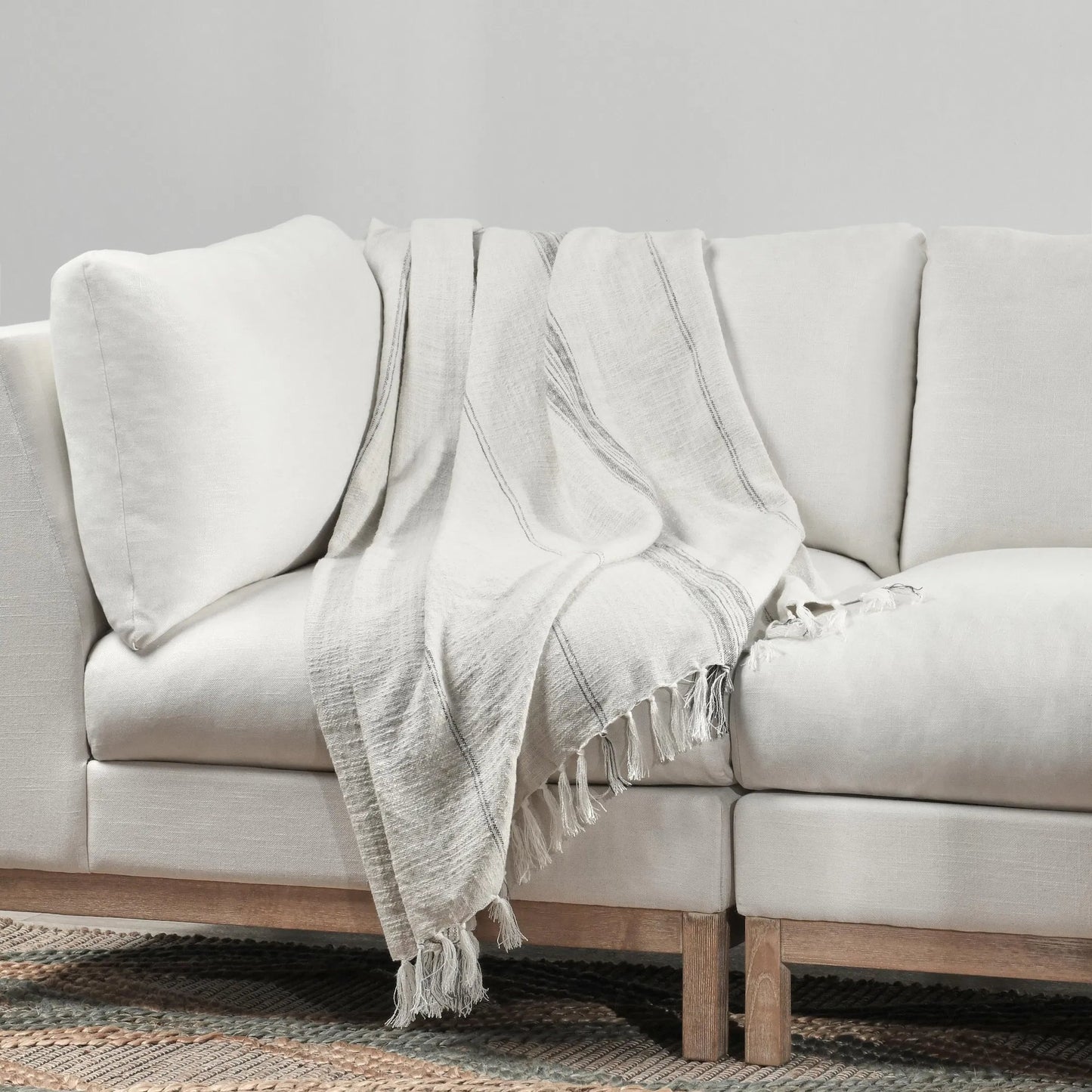 009 SI-2223182 | Lifestyle | Ria Throw Blanket by Villa by Classic Home in ivory, gray. Made from 60% cotton/40% linen in a transitional style.