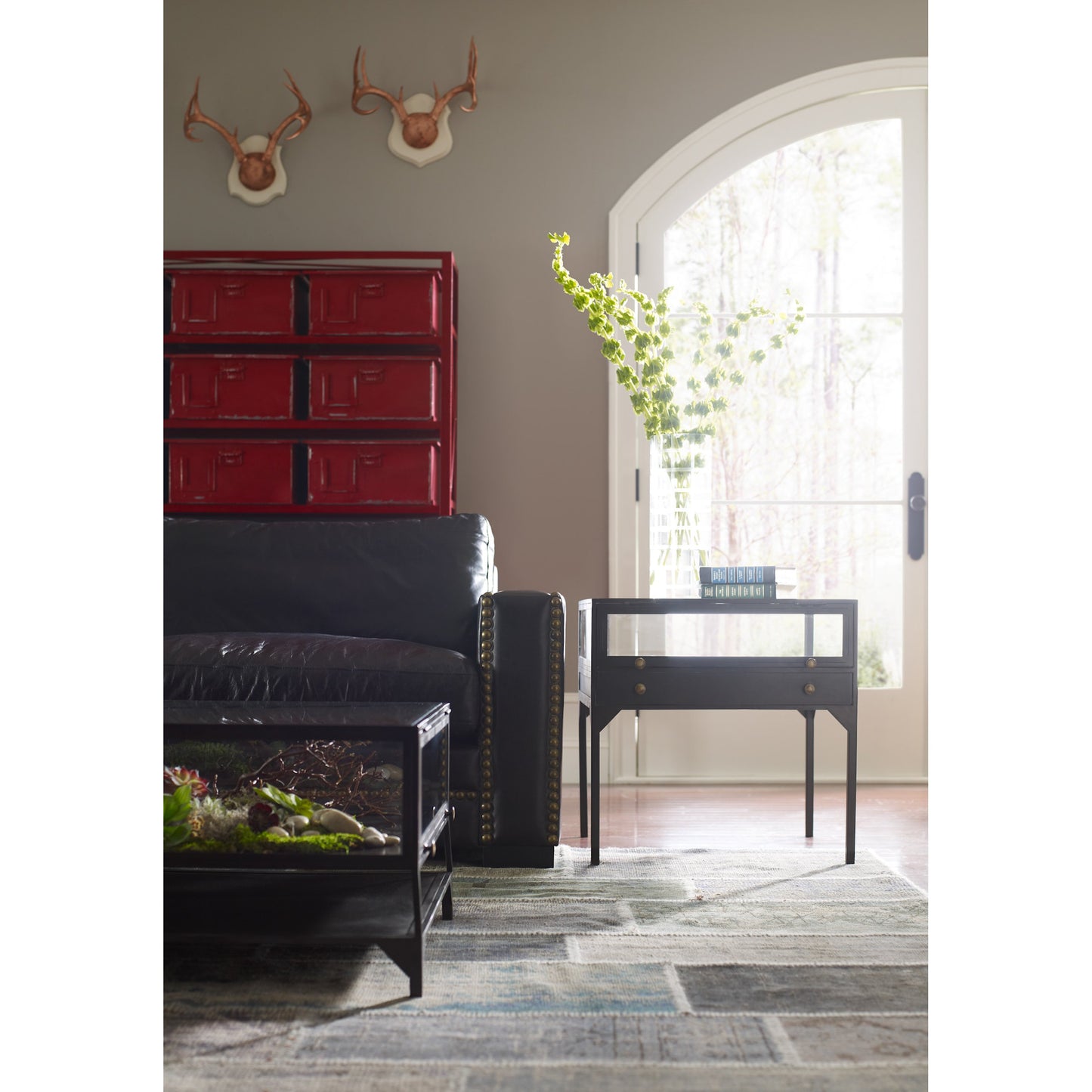 011 SR-369201 | Lifestyle | Shadow Box End Table by Four Hands in black. Made from tempered glass, iron in a modern style.