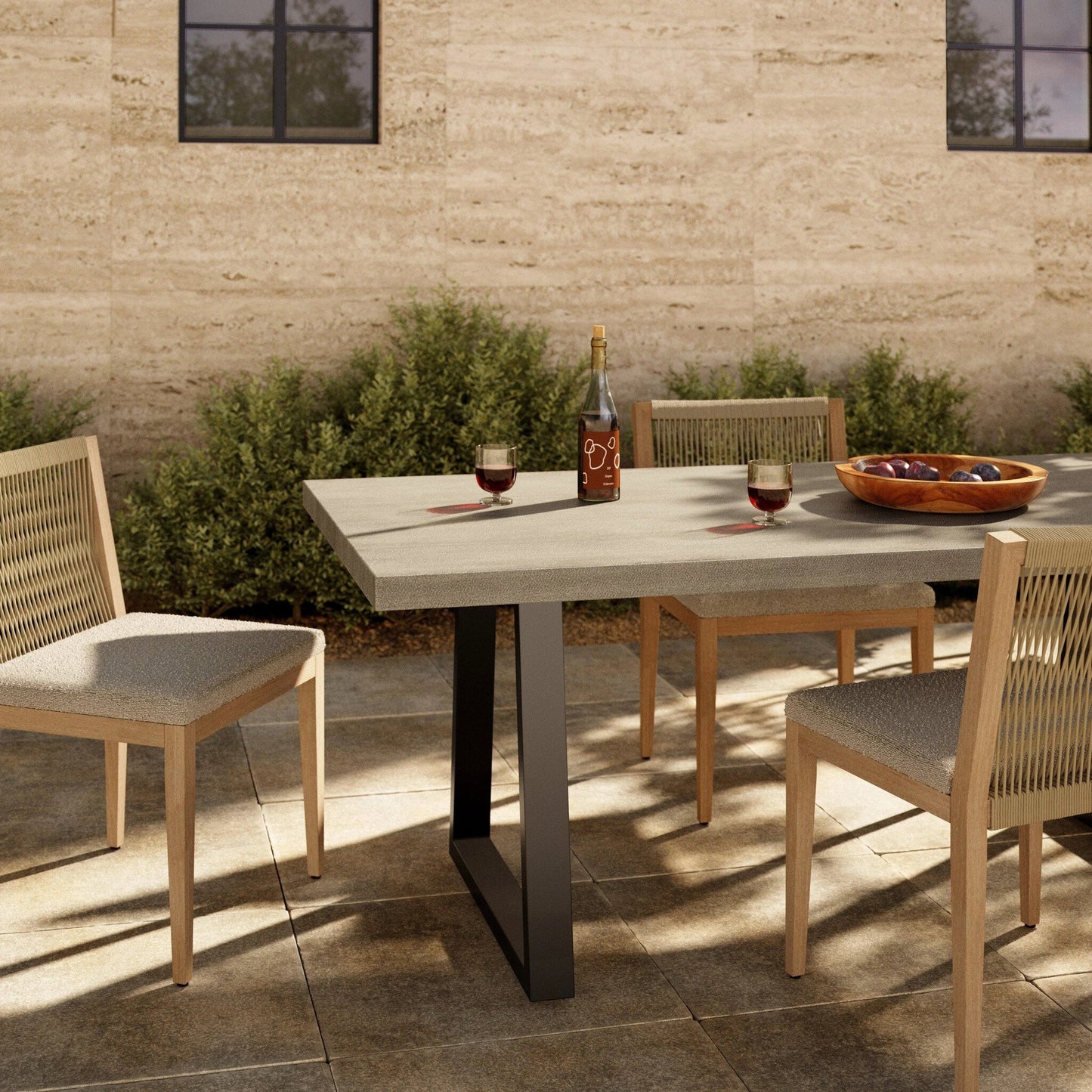 020 S-258305 | Lifestyle | Cyrus Outdoor Dining Table by Four Hands in black, light gray. Made from lavastone composite, iron in a modern style.