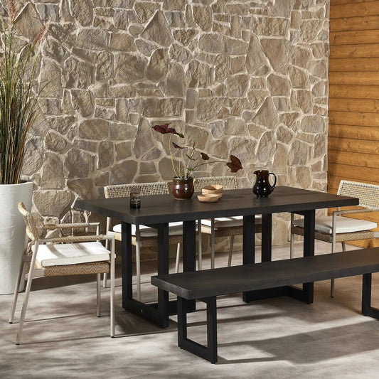 Judith Outdoor Dining Table by Four Hands in black, black lavastone. Made from lavastone composite, iron in a modern style.