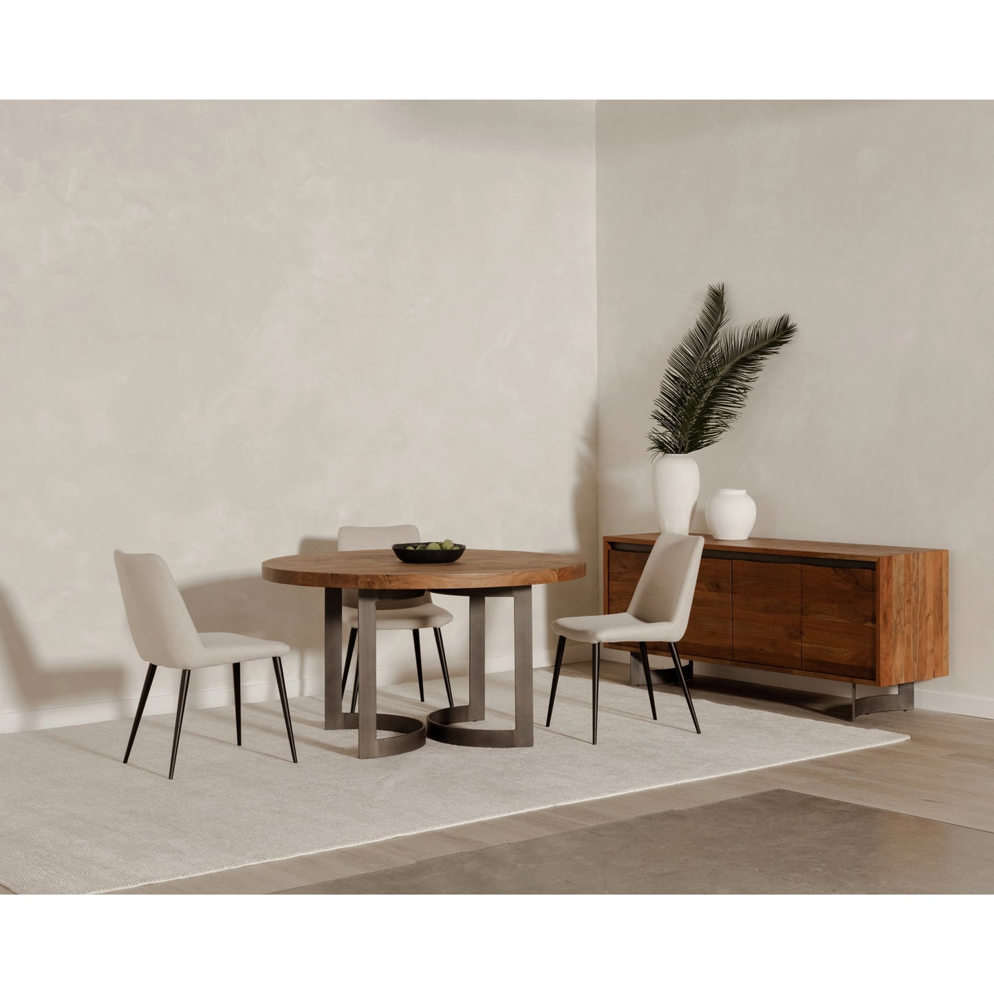 016 SI-2121877 | Lifestyle | Bent Round Dining Table by Moe's Home Collection in brown. Made from solid acacia top, solid iron legs in a modern style.