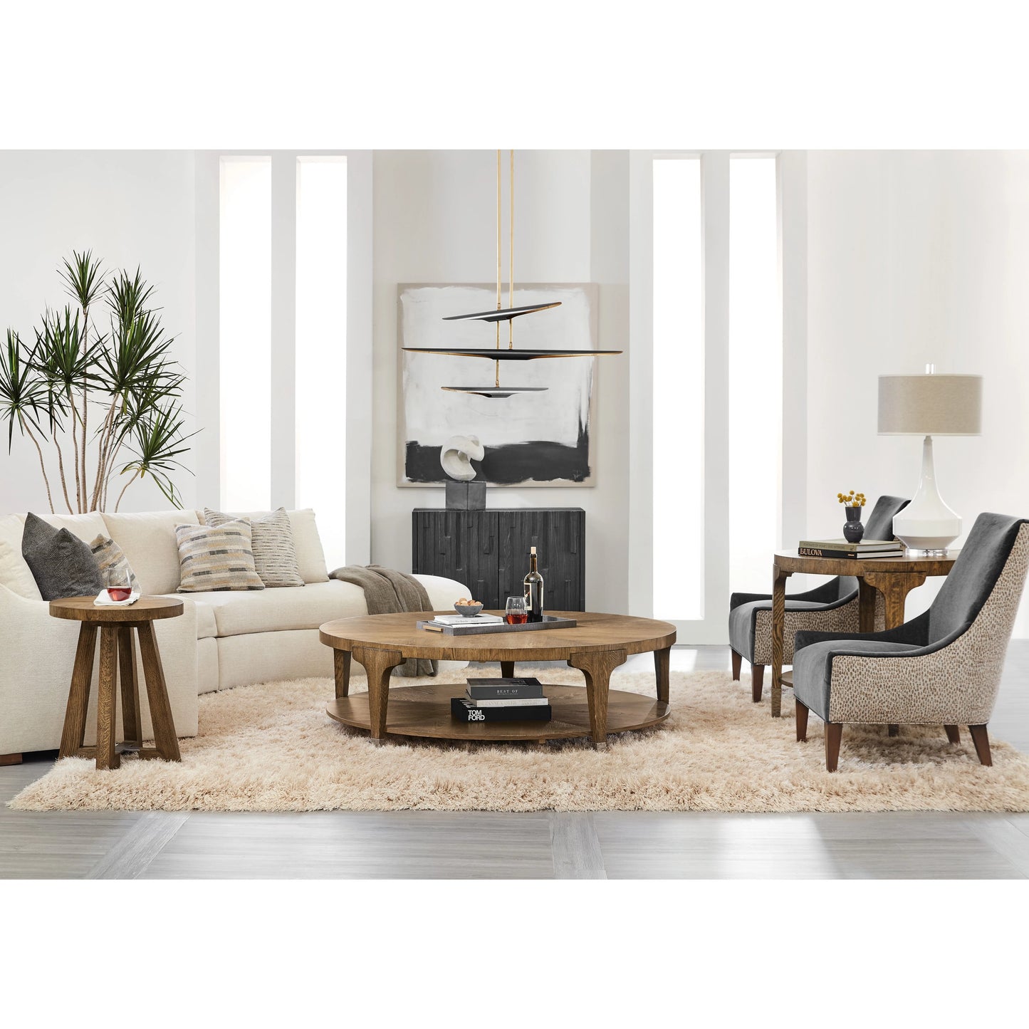 004 SI-1959574 | Lifestyle | Chapman Round Side Table by Hooker Furniture in sorrel. Made from white oak veneers, metal ferrules in a transitional style.