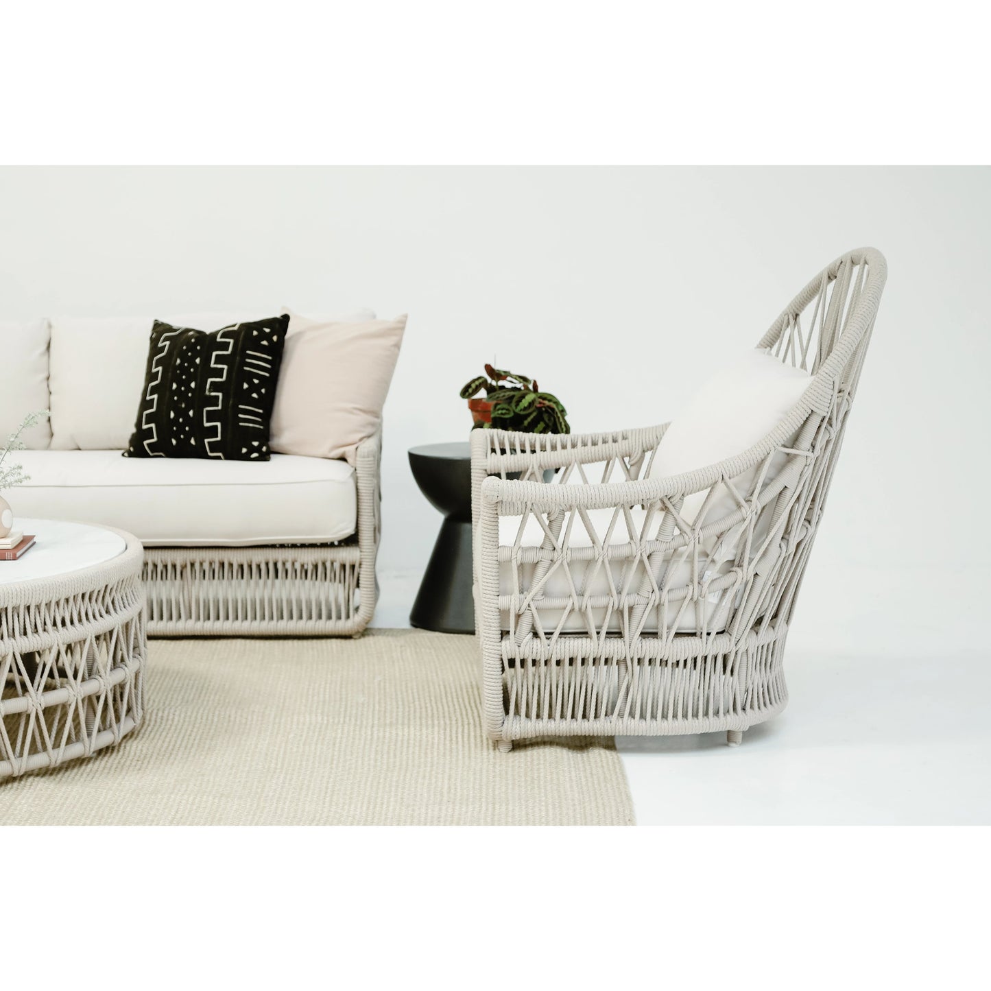 011 SI-2167044 | Lifestyle | Dana Outdoor Rope Wing Chair in Linen by Sunset West in natural. Made from olefin rope in a coastal style.