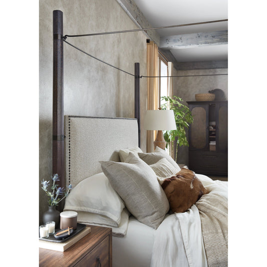 Big Sky Poster Bed by Hooker Furniture in beige and charred timber. Made from pecky hickory veneers, fabric, metal, nailheads in a modern style.