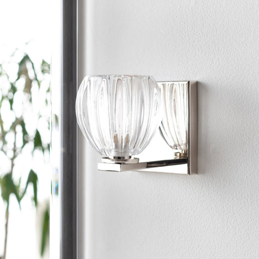 Wallace Wall Sconce by Surya in clear, metallic bronze, metallic nickel and polished. Made from fixture: metal in a modern style.