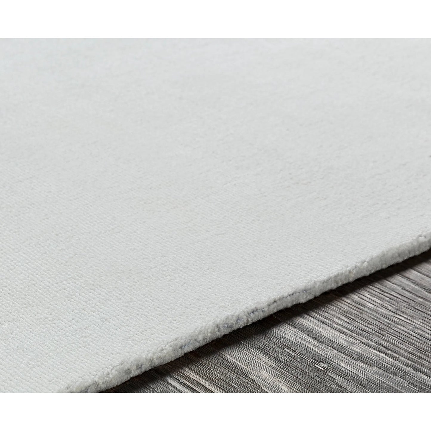 008 SI-2130959,SI-2130960,SI-2130961 | Closeup | Wilkinson Rug by Livabliss in white. Made from face: 100% polyester, warp: 100% cotton in a coastal style.