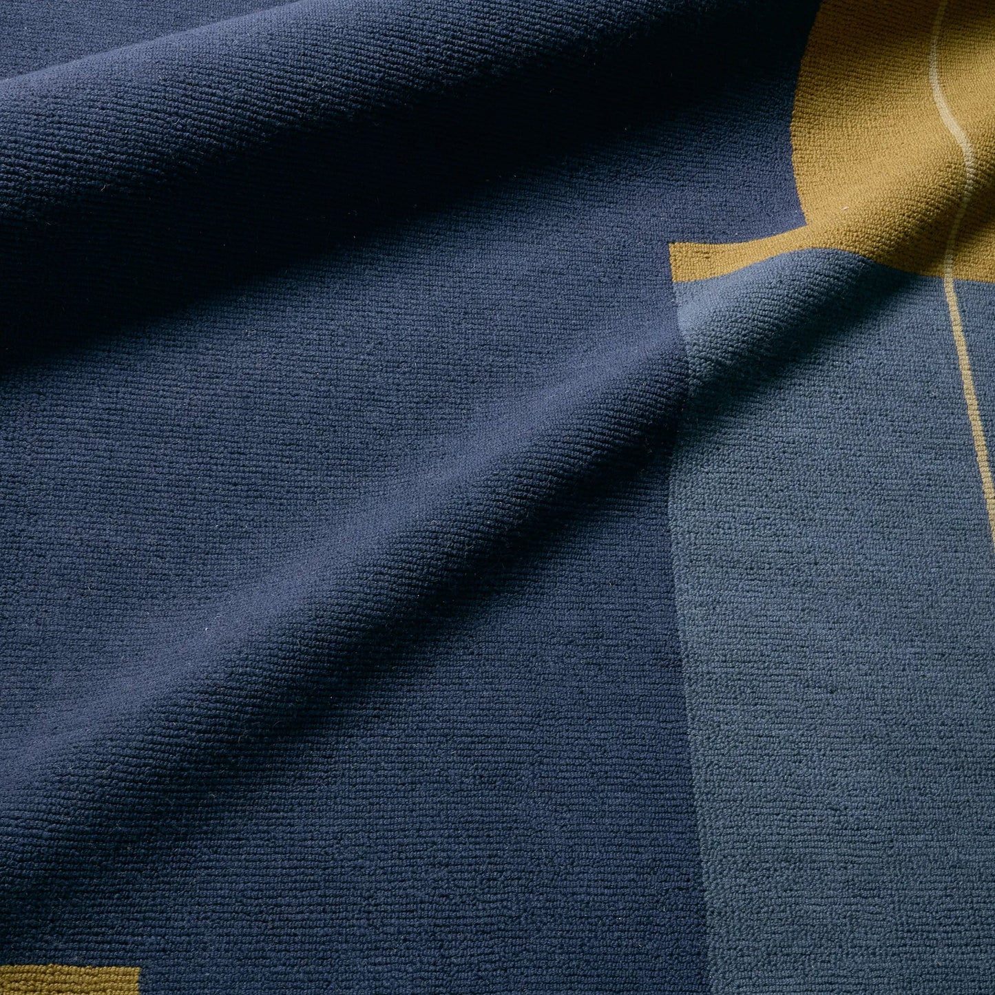 006 SI-2531451,SI-2531452,SI-2531453,SI-2531454,SI-2531455 | Closeup | Woven Construct WVC02 Rug by Jaipur Living in blue, yellow, gold. Made from 65% wool 35% cotton in a unique style.