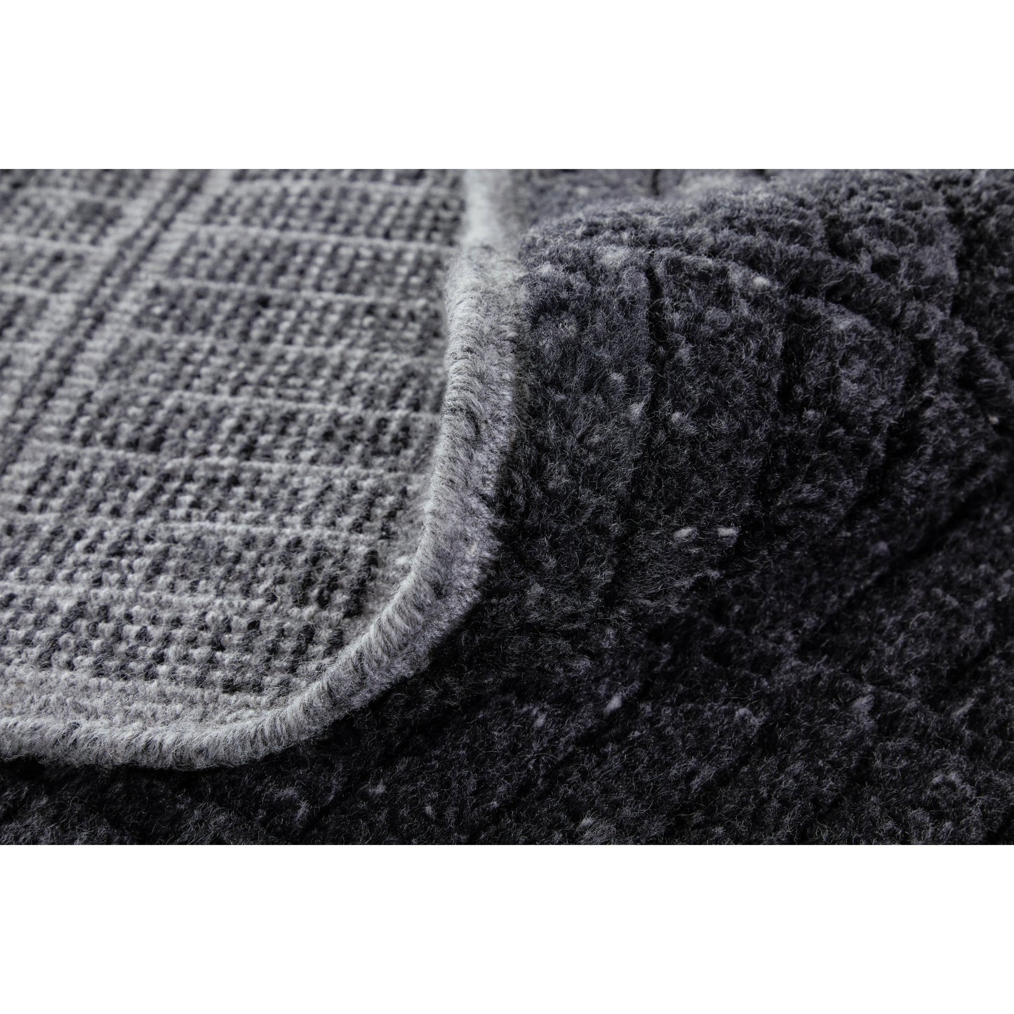 005 SI-2159065,SI-2159066,SI-2159067,SI-2159068,SI-2159071,SI-2159314 | Closeup | Vesper Transitional Solid Rug - T20T6036 by Thom Felicia by Feizy Rugs in black. Made from wool in a unique style.