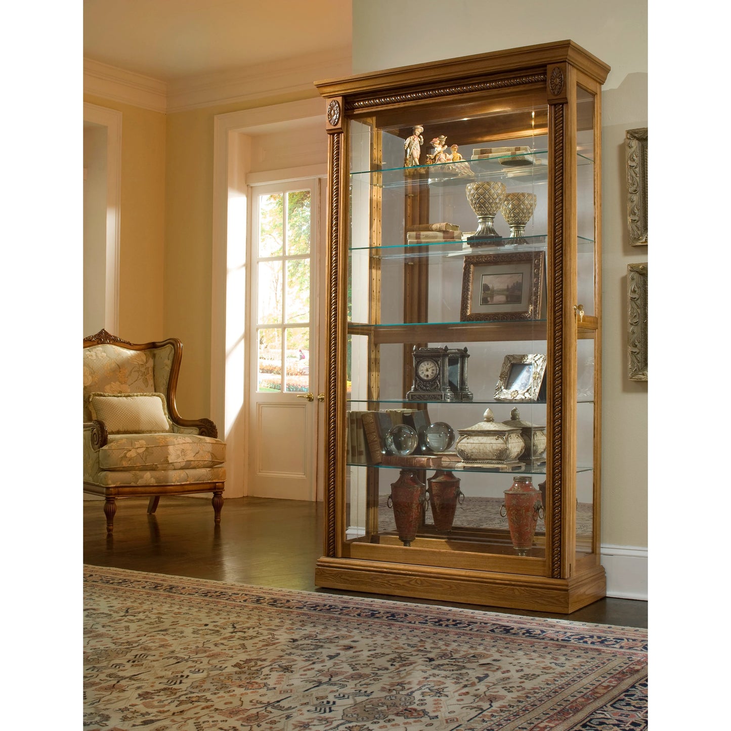 003 SI-2155652 | Lifestyle | 43'' Wide Hardwood Two Way Sliding Door Curio Cabinet in Warm Honey by Pulaski Furniture in warm honey-tone. Made from hardwood solids in a traditional style.