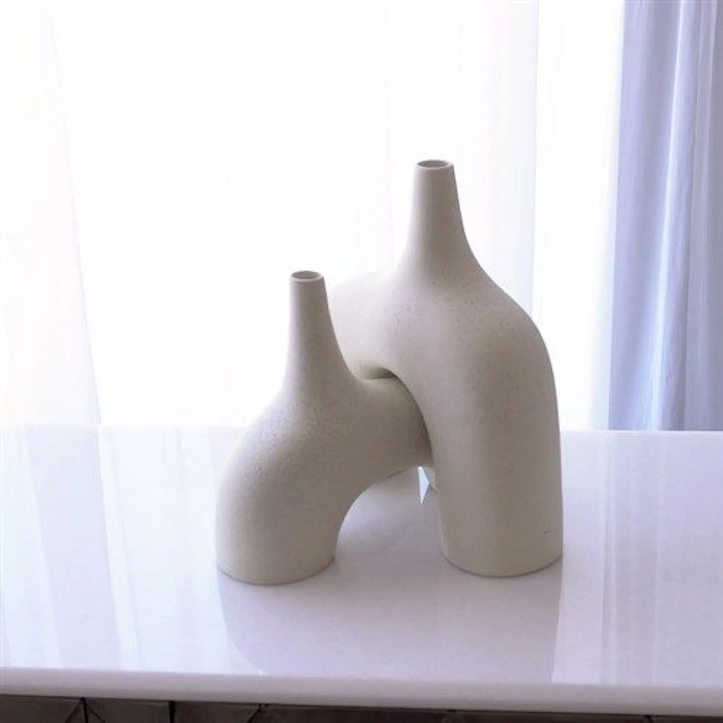 016 SR-893238,SR-893239 | Unknown | Stretch Vase by Global Views. Made from earthenware in a eclectic & global style.