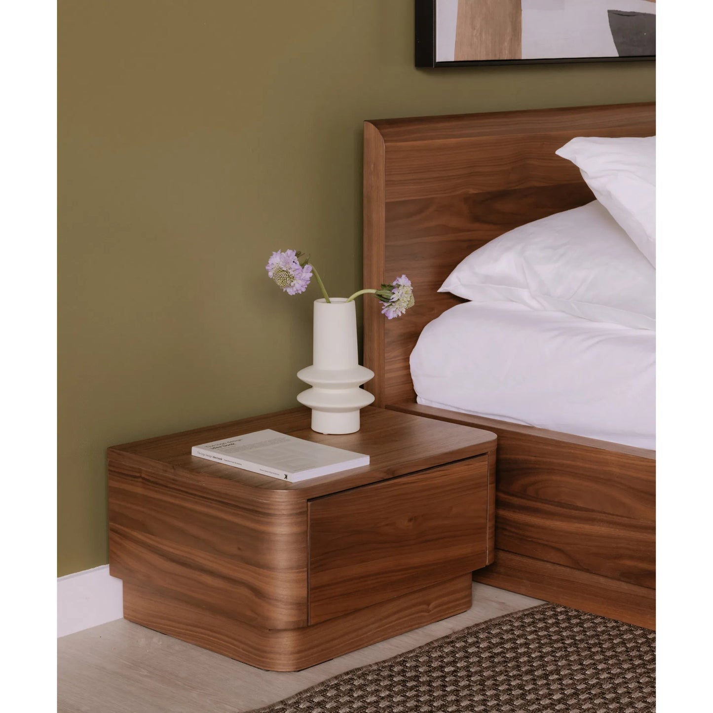 003 SI-2253995 | Lifestyle | Round Off Small Nightstand by Moe's Home Collection in natural walnut. Made from walnut veneer, mdf, rubbwrwood base in a transitional style.